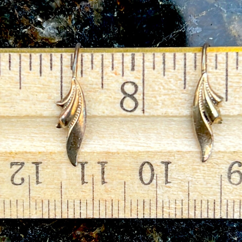 Tiny earrings, even small enough for a young child. No makers mark that I see.